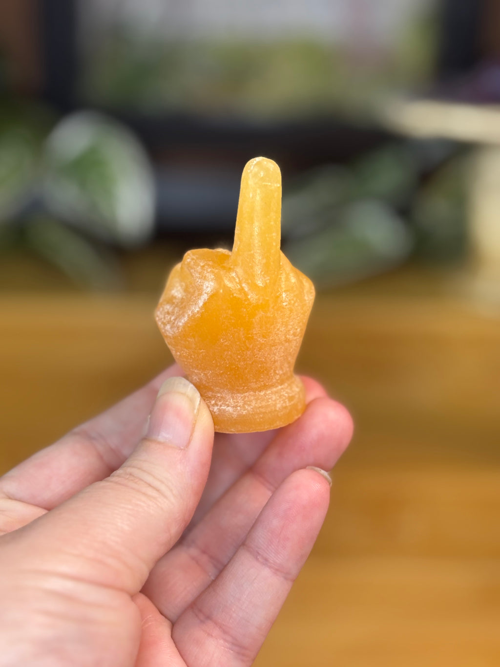 Orange Calcite Middle Finger Carving
