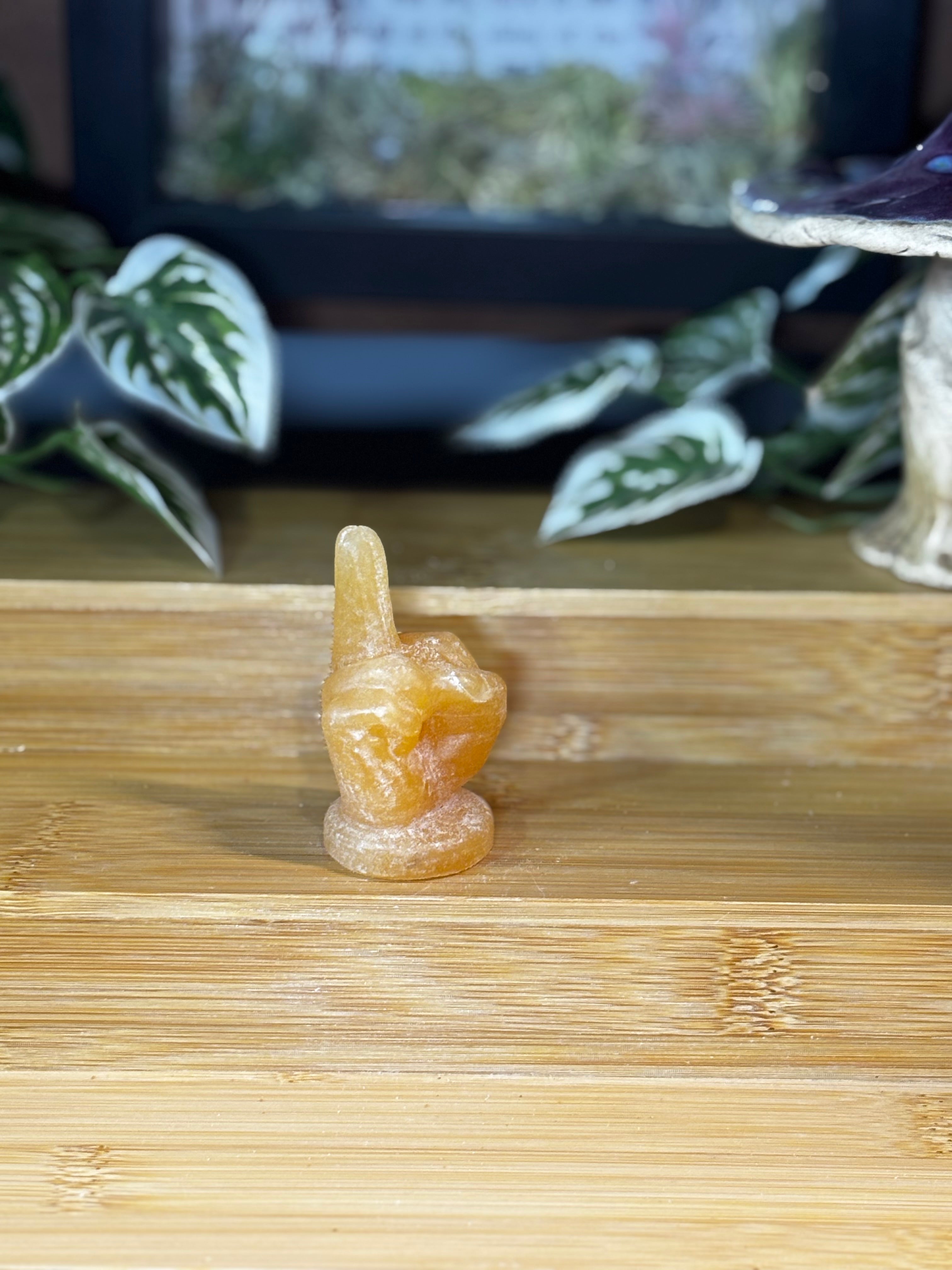 Orange Calcite Middle Finger Carving
